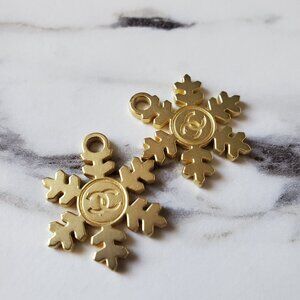 2 authentic chanel snowflake charms.